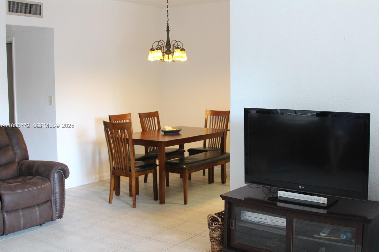 1300 North Ocean Boulevard, Unit 111 Pompano Beach, FL 33062 - Photo 22 of 26 a view of a livingroom with furniture