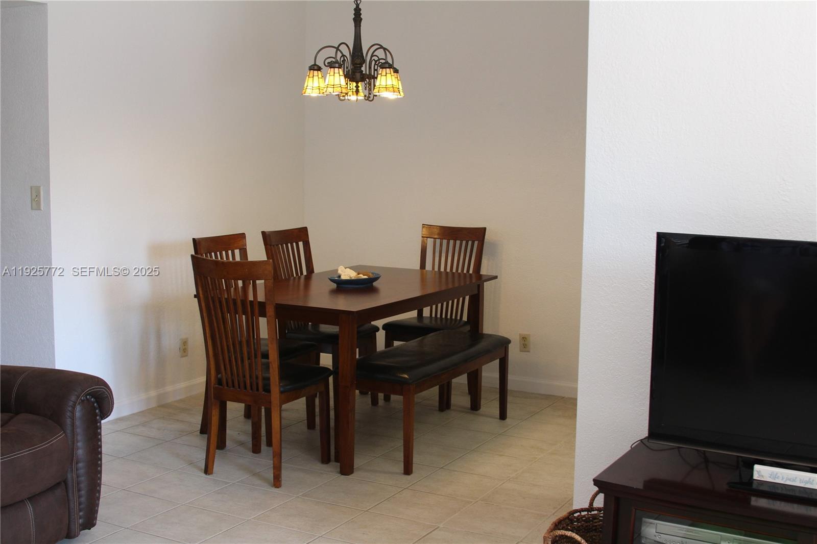 1300 North Ocean Boulevard, Unit 111 Pompano Beach, FL 33062 - Photo 23 of 26 a view of a dining room with furniture