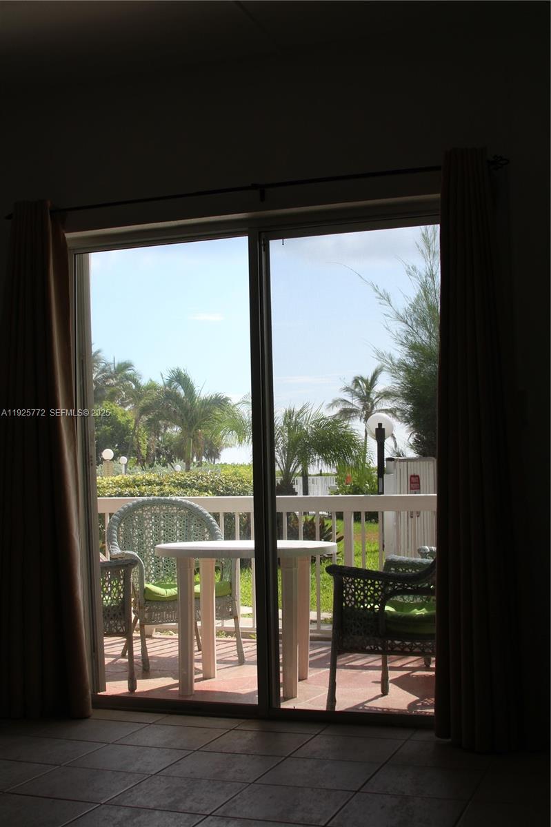 1300 North Ocean Boulevard, Unit 111 Pompano Beach, FL 33062 - Photo 26 of 26 a view of a glass door with a floor to ceiling window
