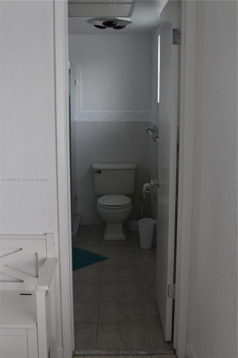 1300 North Ocean Boulevard, Unit 111 Pompano Beach, FL 33062 - Photo 9 of 26 a bathroom with a toilet