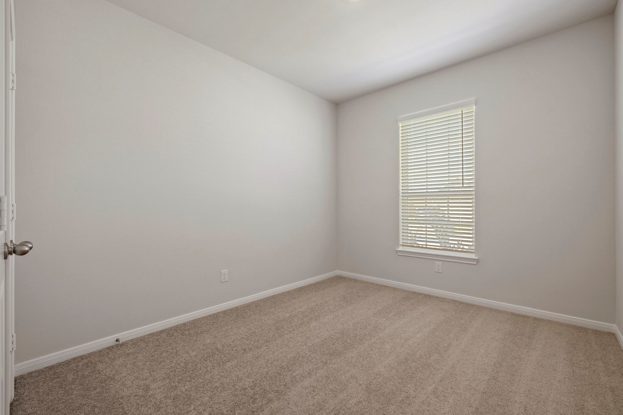 7506 Tipton Meadow Way Richmond, TX 77469 - Photo 13 of 21 an empty room with a window