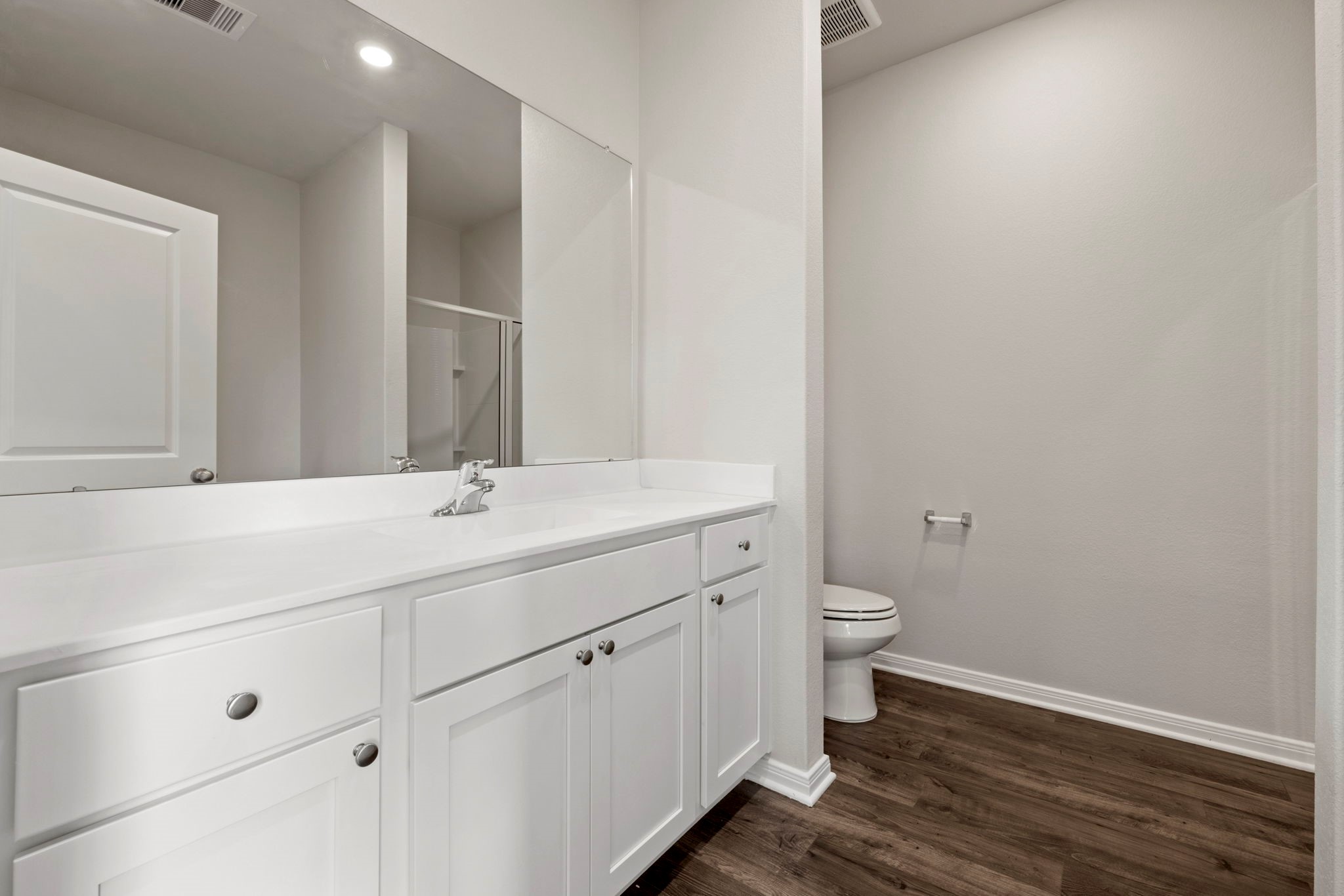 7506 Tipton Meadow Way Richmond, TX 77469 - Photo 18 of 21 a bathroom with a double vanity sink toilet and a mirror