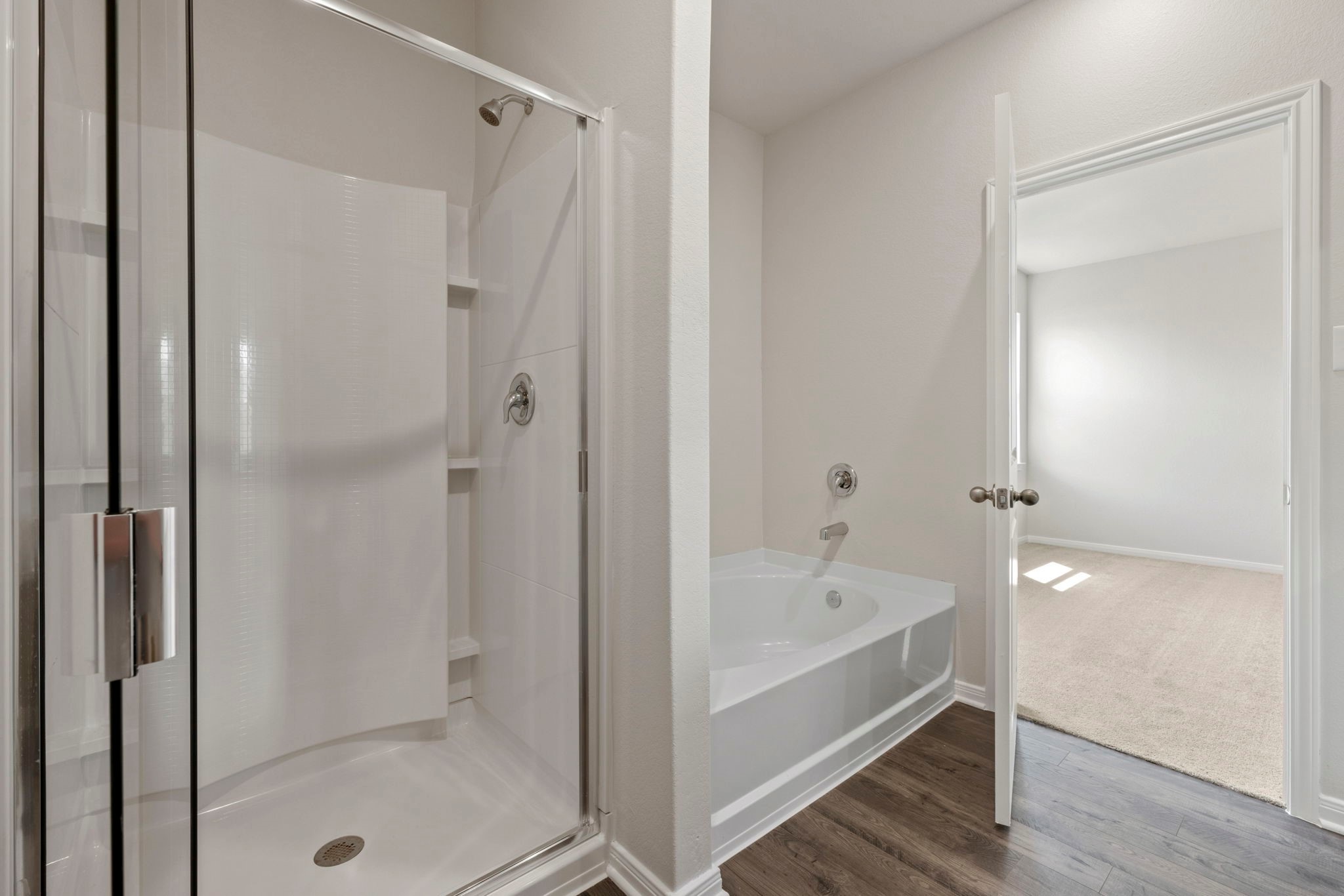 7506 Tipton Meadow Way Richmond, TX 77469 - Photo 19 of 21 a bathroom with a bathtub and a shower