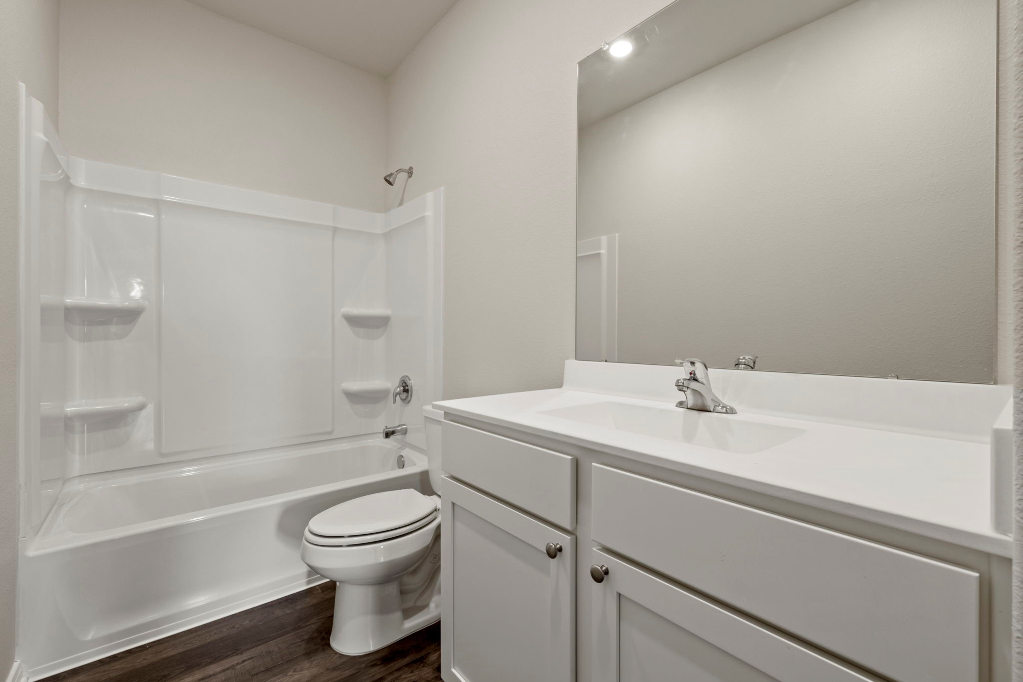 7506 Tipton Meadow Way Richmond, TX 77469 - Photo 20 of 21 a bathroom with a granite countertop toilet a sink and a bathtub