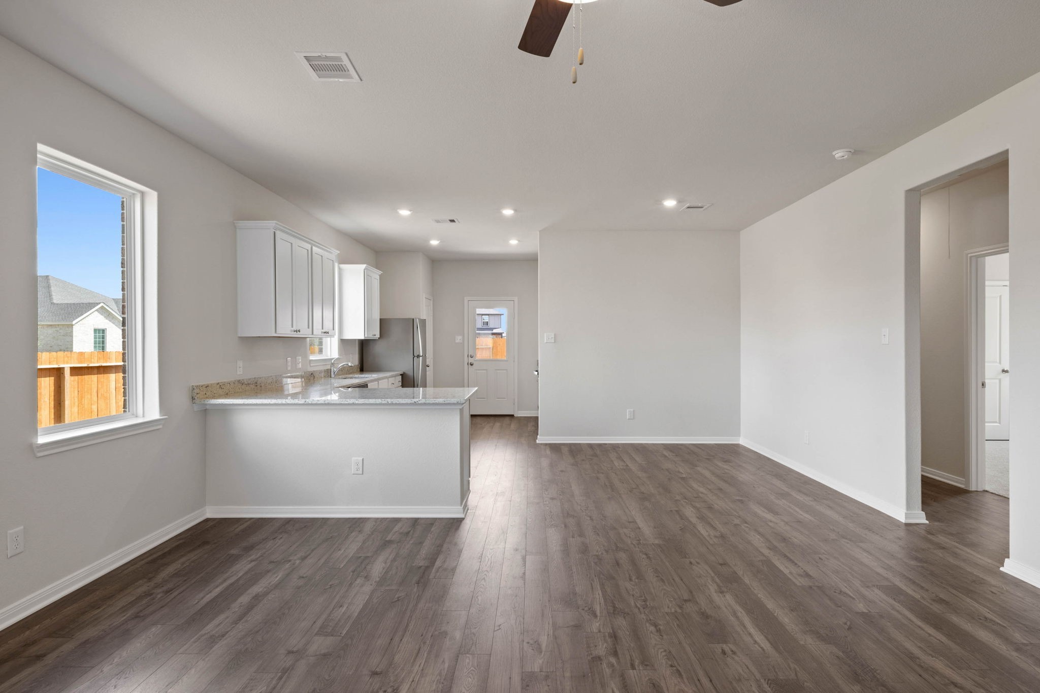 7506 Tipton Meadow Way Richmond, TX 77469 - Photo 3 of 21 a view of kitchen with sink and wooden floor