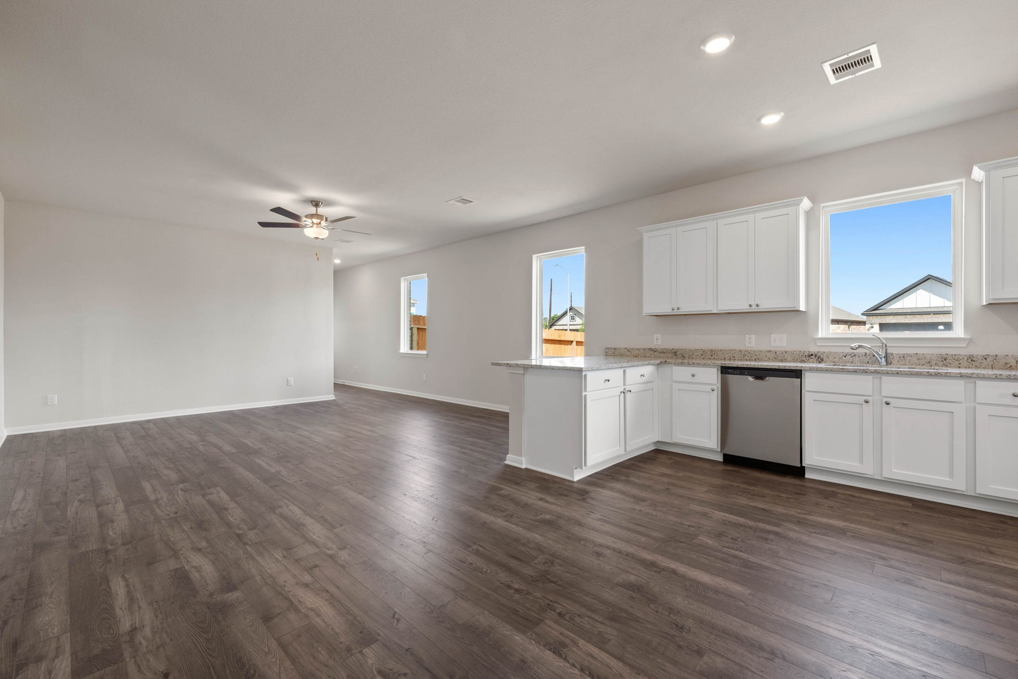 7506 Tipton Meadow Way Richmond, TX 77469 - Photo 5 of 21 a view of kitchen with granite countertop cabinets and window