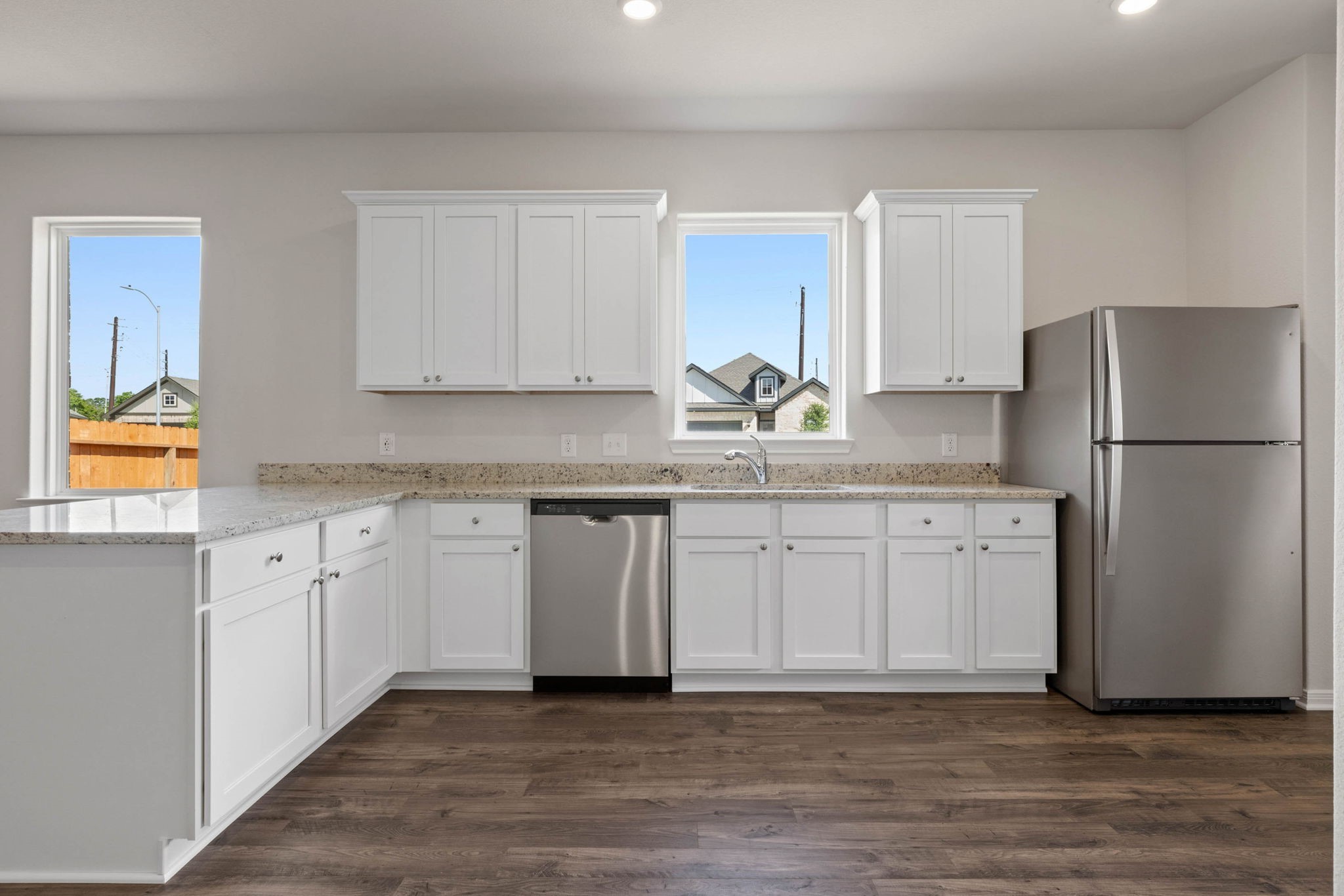 7506 Tipton Meadow Way Richmond, TX 77469 - Photo 6 of 21 a kitchen with stainless steel appliances granite countertop a refrigerator sink and cabinets