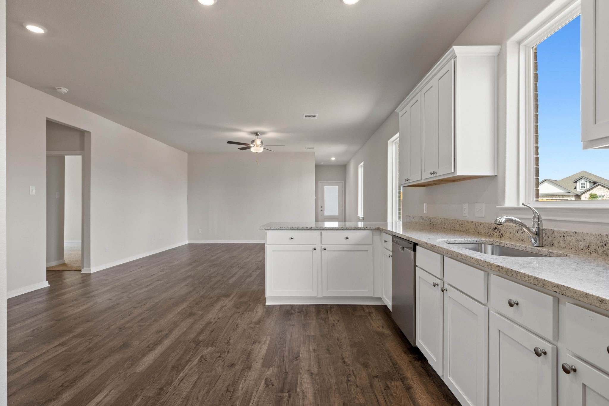 7506 Tipton Meadow Way Richmond, TX 77469 - Photo 7 of 21 a kitchen with a sink window and cabinets