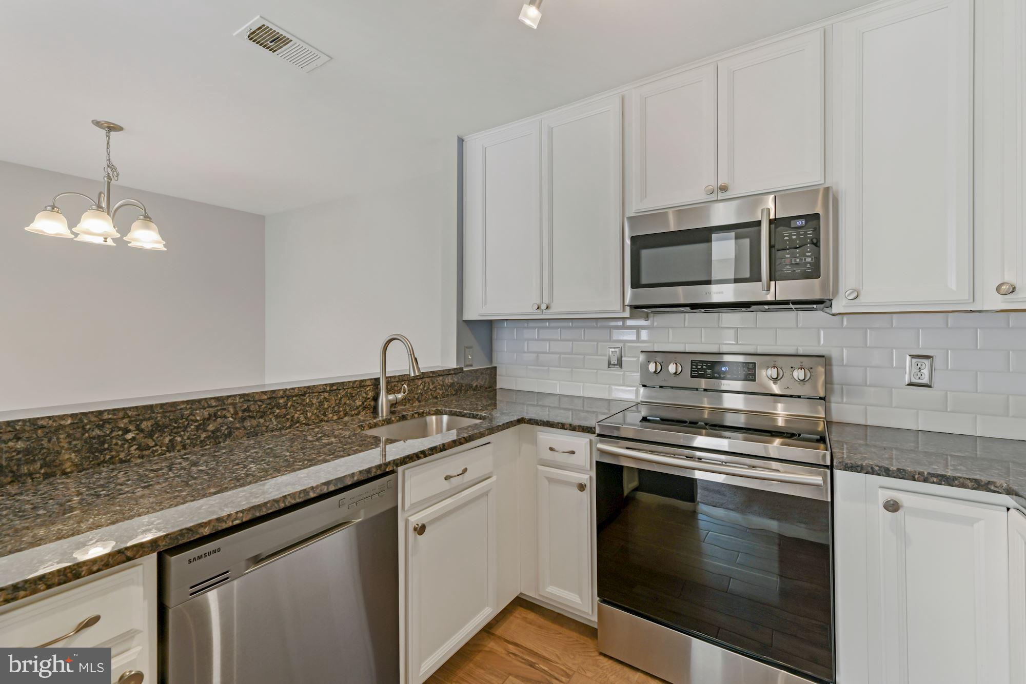 7817 D Harrowgate Circle, Unit 156 Springfield, VA 22152 - Photo 14 of 26 Open to Dining room