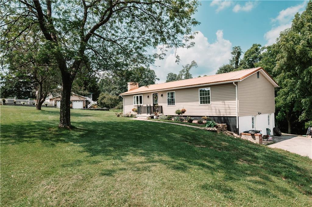 184 Mountain View Road Penn Run, PA 15765 - Photo 3 of 31 a front view of house with yard and green space