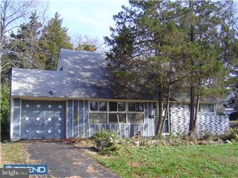 40 Jollybrook Road Levittown, PA 19056 - Photo 1 of 6 a front view of house with yard and trees around