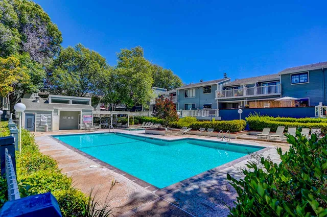 a view of a house with swimming pool yard and patio