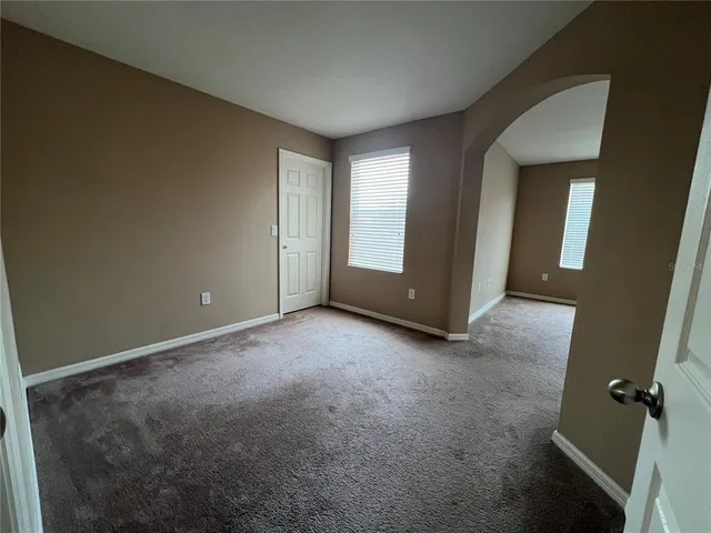 a bathroom with a granite countertop sink a bathtub and shower