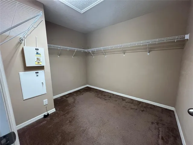 a bathroom with a granite countertop sink a toilet and bathtub