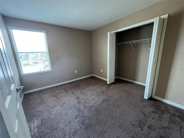 a view of an empty room with glass door