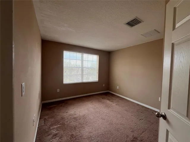 a view of a room with large window