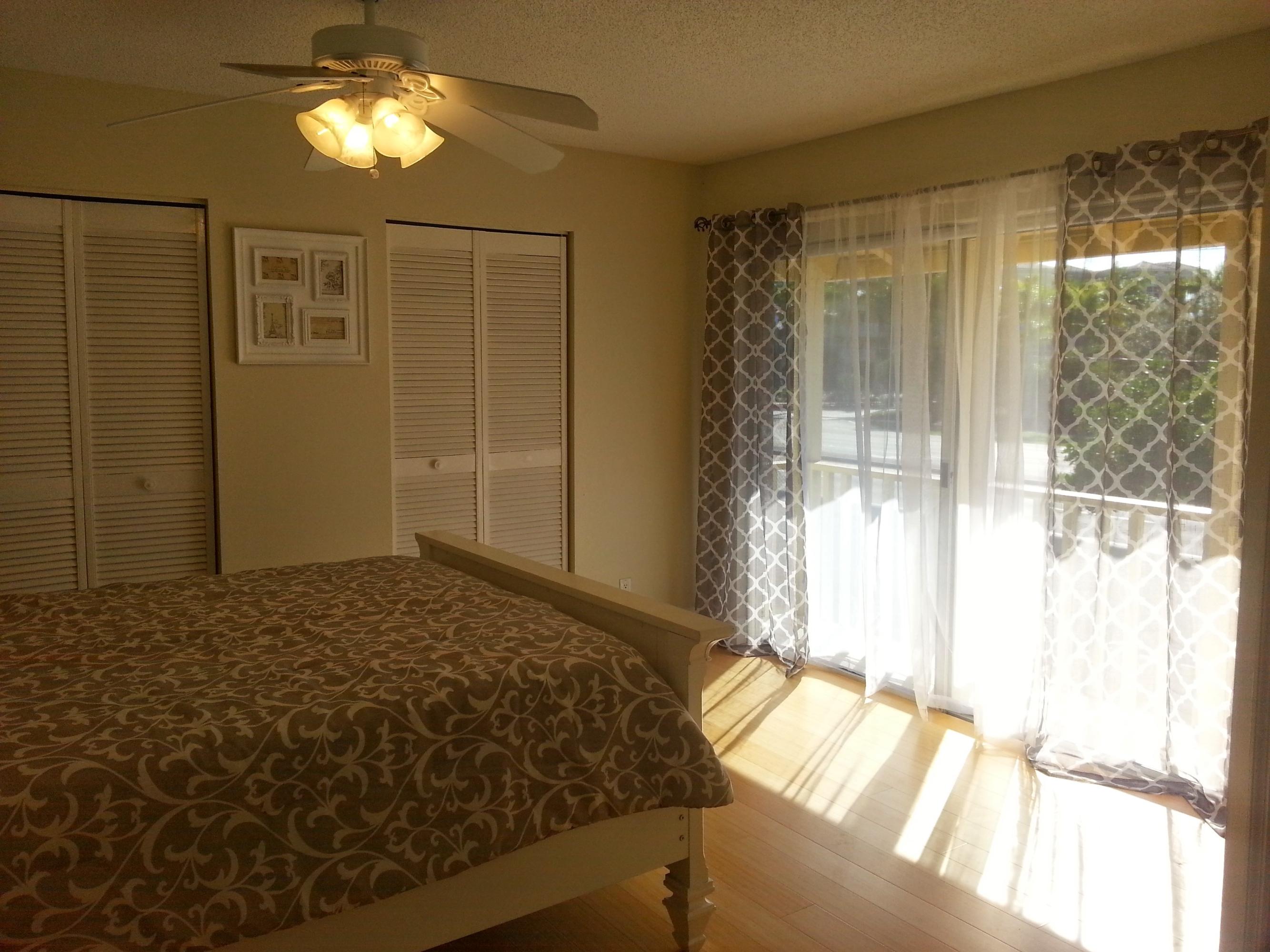 169 Seabreeze Circle Jupiter, FL 33477 - Photo 15 of 25 Guest Bedroom with Balcony