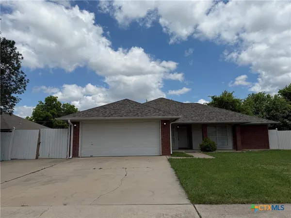 front view of a house with a garden