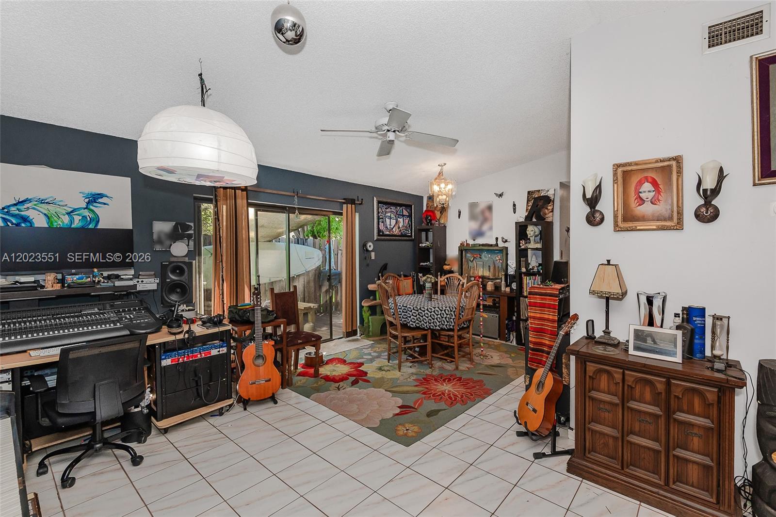 11482 Southwest 109th Road, Unit 29A Miami, FL 33176 - Photo 3 of 28 a living room with lots of furniture and a chandelier