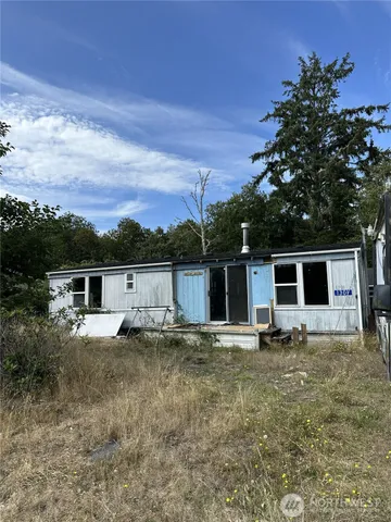 a house with trees in the background