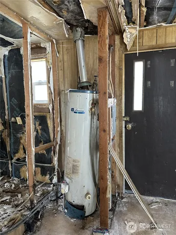 a view of walk in closet with clothes