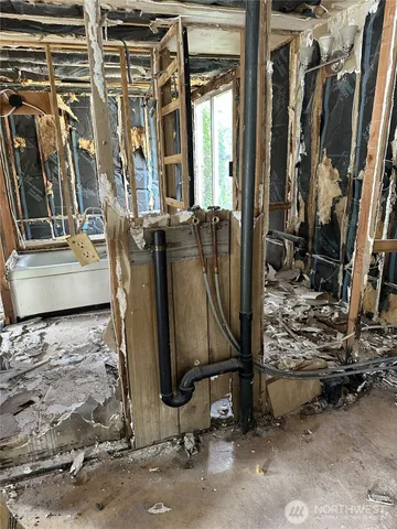 a bathroom with a tub and a window