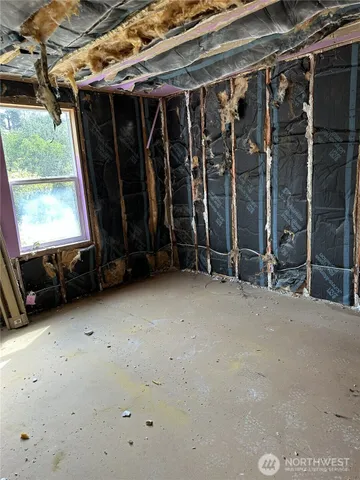 a view of a room with wooden walls