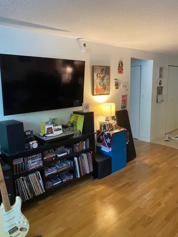 a view of a livingroom with furniture and a flat screen tv