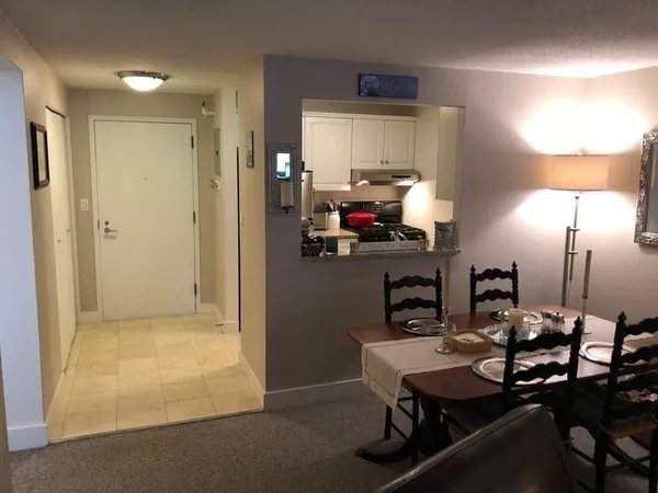 a kitchen with a table and chairs in it