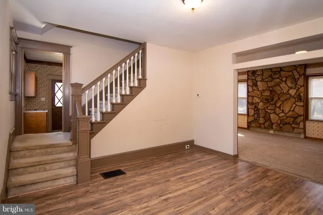 a view of entryway with wooden floor