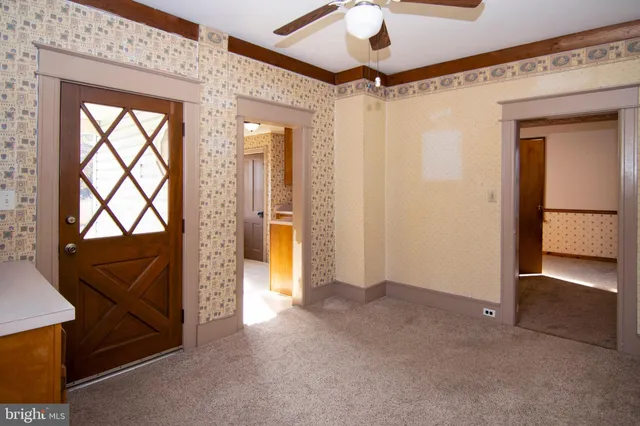 a view of an empty room with a window