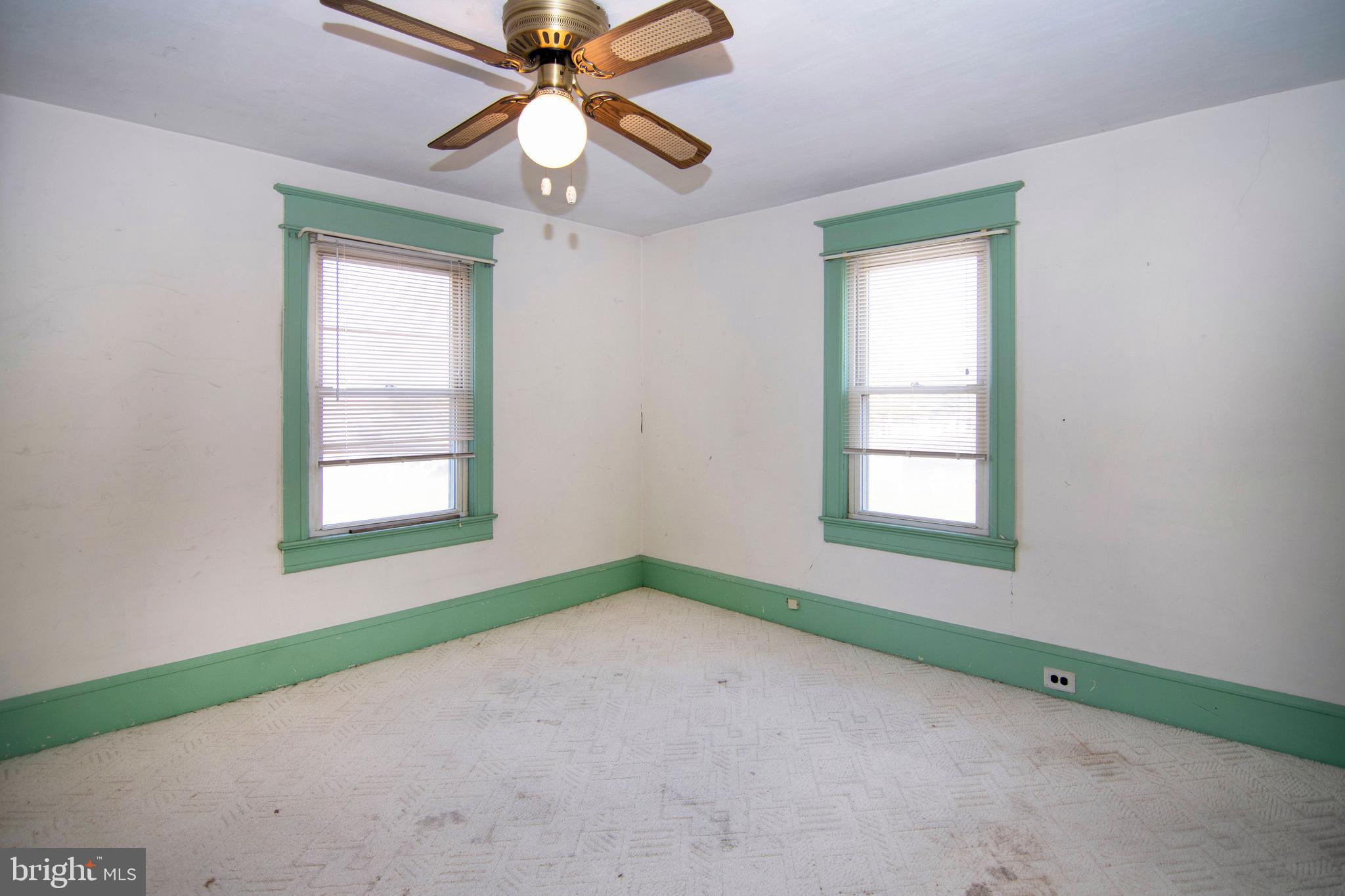 546 Williamstown Road Sicklerville, NJ 08081 - Photo 22 of 44 an empty room with chandelier fan and windows