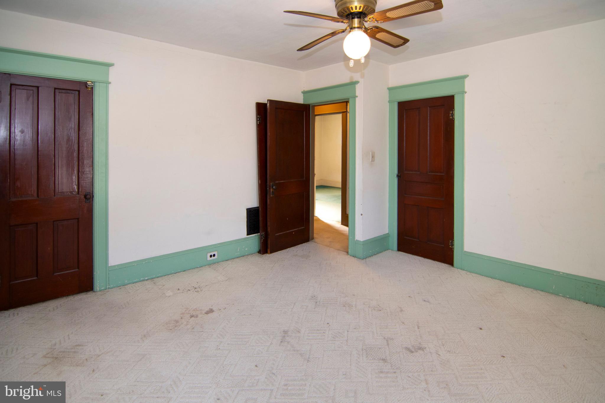 546 Williamstown Road Sicklerville, NJ 08081 - Photo 25 of 44 an empty room with closet and fan