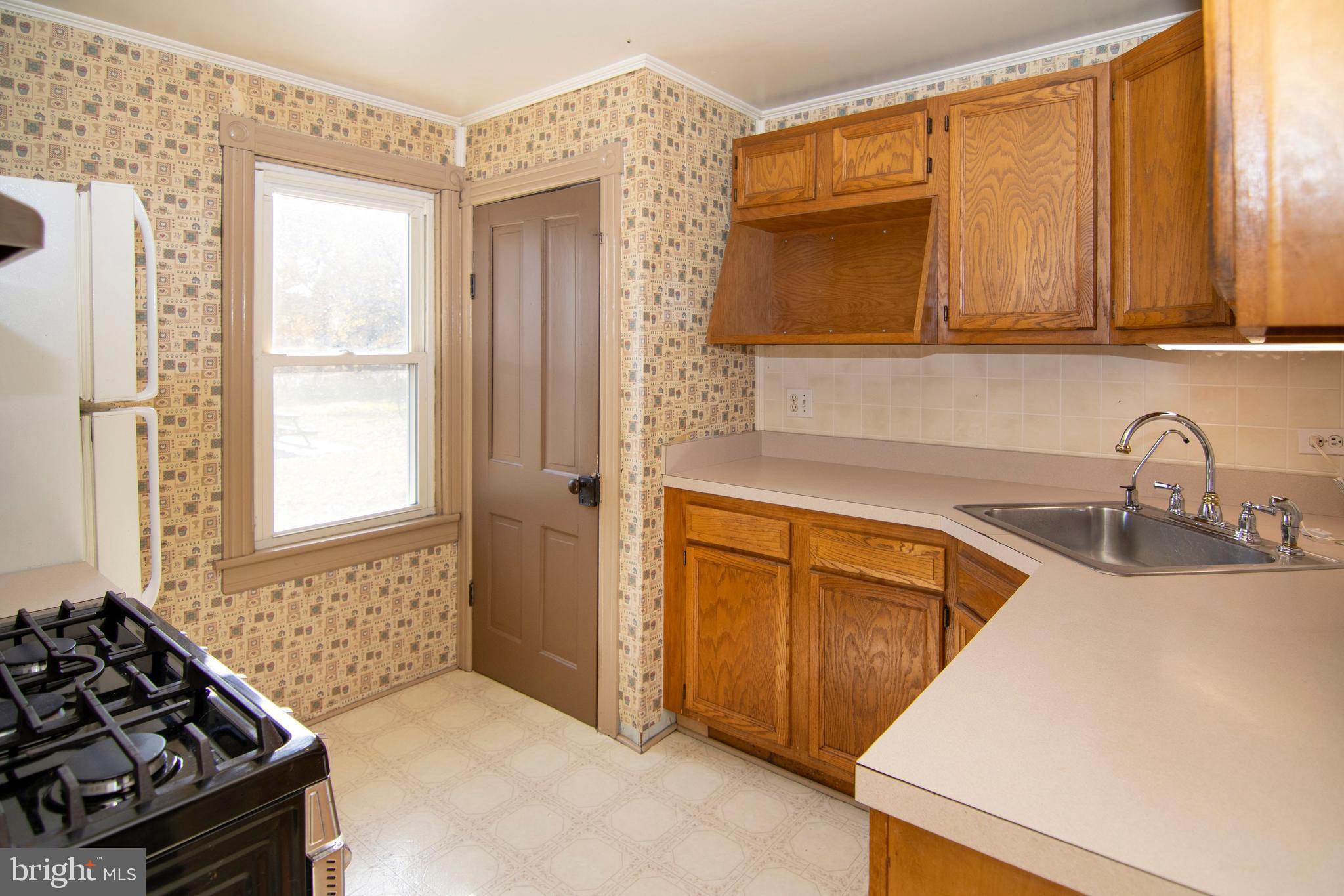 546 Williamstown Road Sicklerville, NJ 08081 - Photo 9 of 44 a kitchen with stainless steel appliances granite countertop a sink and a stove