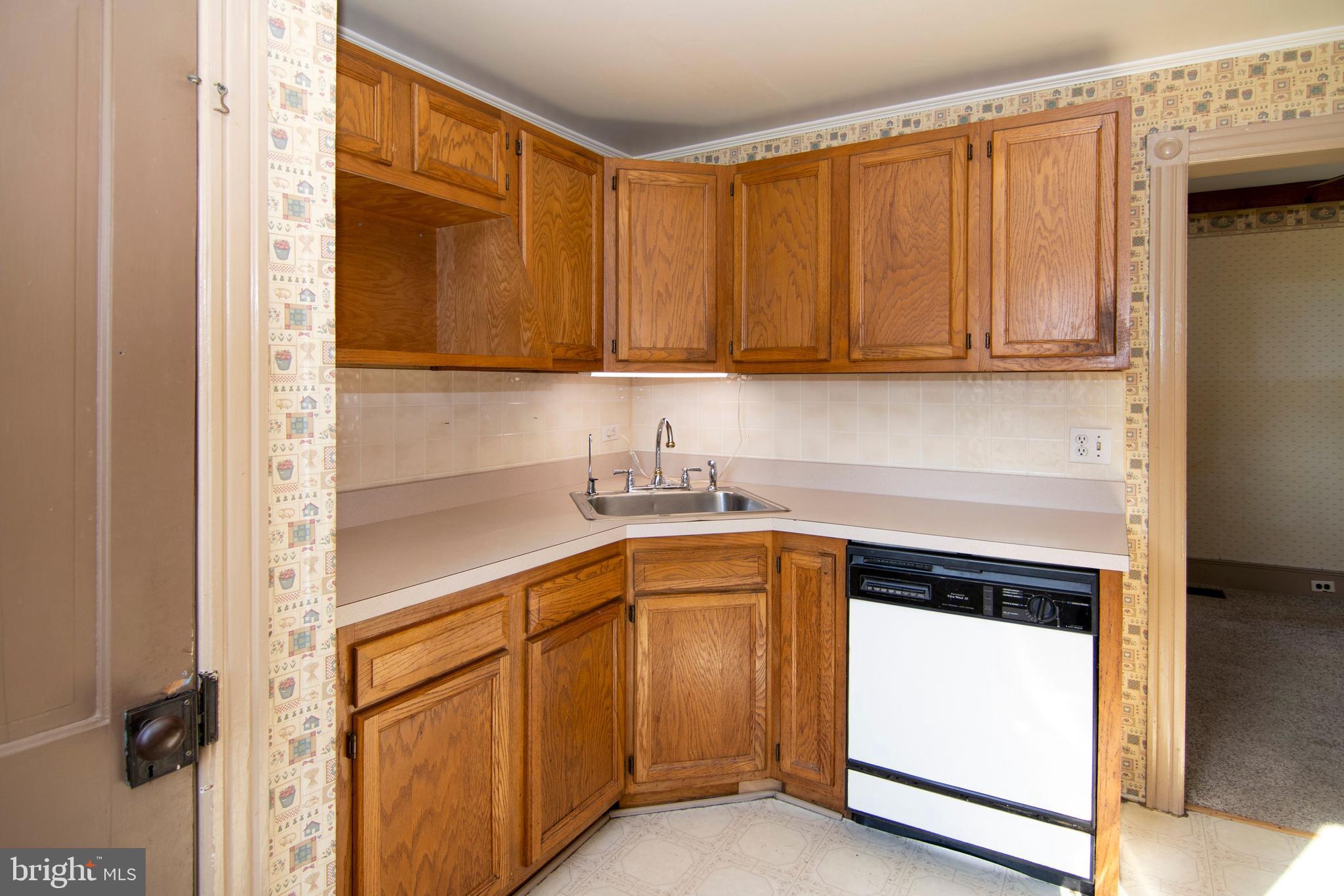 546 Williamstown Road Sicklerville, NJ 08081 - Photo 10 of 44 a kitchen with a sink and a refrigerator
