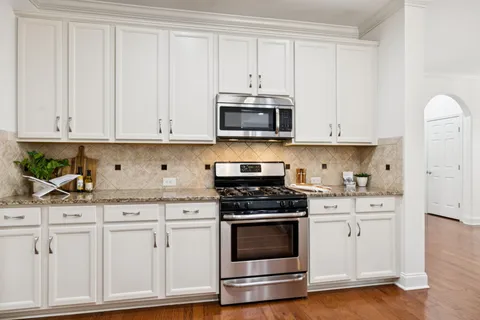 a living room with furniture a window and fireplace