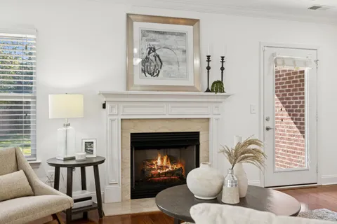 a living room with furniture or kitchen view and a chandelier