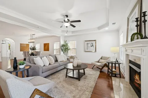 a spacious bathroom with a double vanity sink a mirror and a