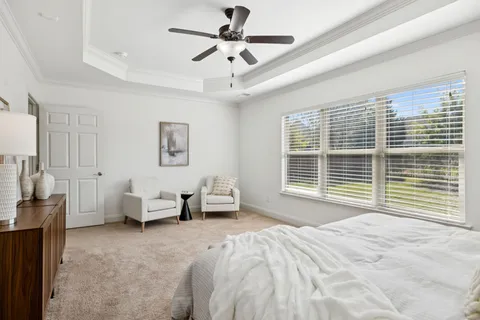 an aerial view of a house with a yard