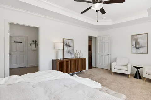an aerial view of residential houses with outdoor space and parking