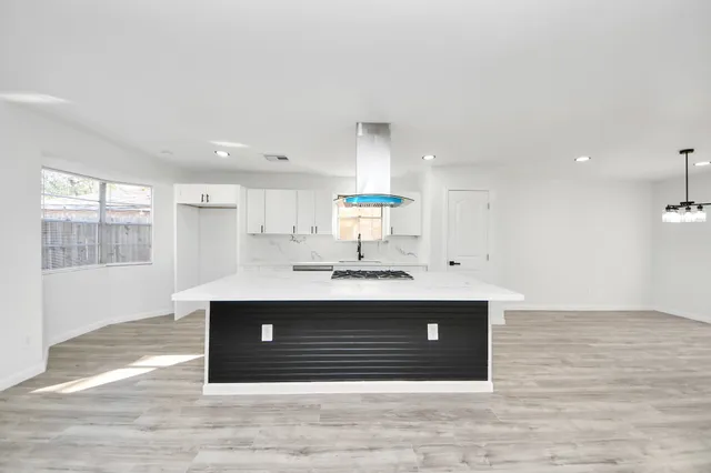 a view with a sink and mirror