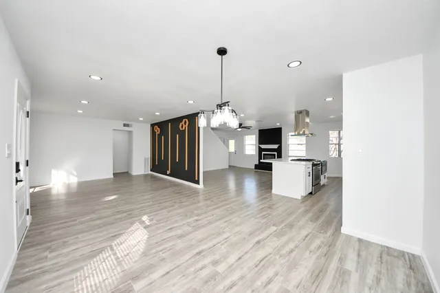 a view of a kitchen with a sink and a living room