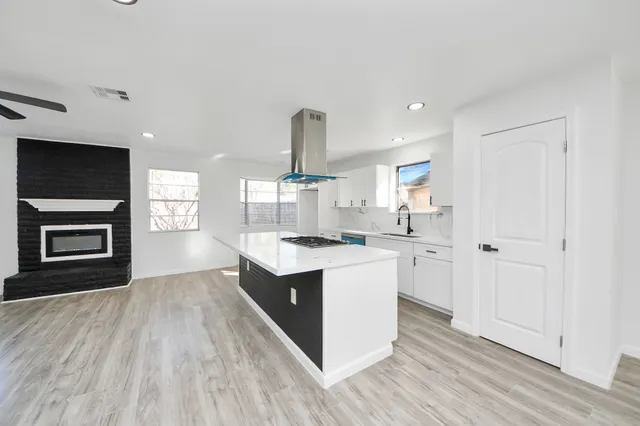 a view of kitchen with sink and wooden floor