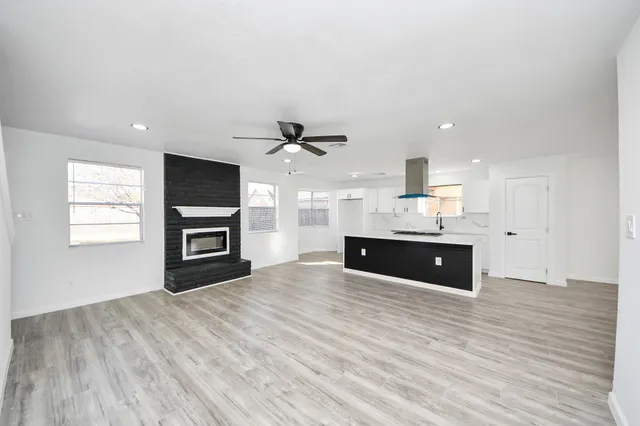 a view of a kitchen with a sink and a window