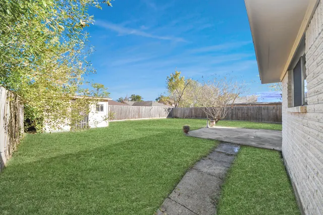 a view of a wooden door in front of a house