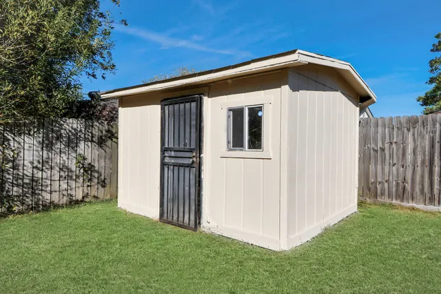 an aerial view of multiple houses with outdoor space