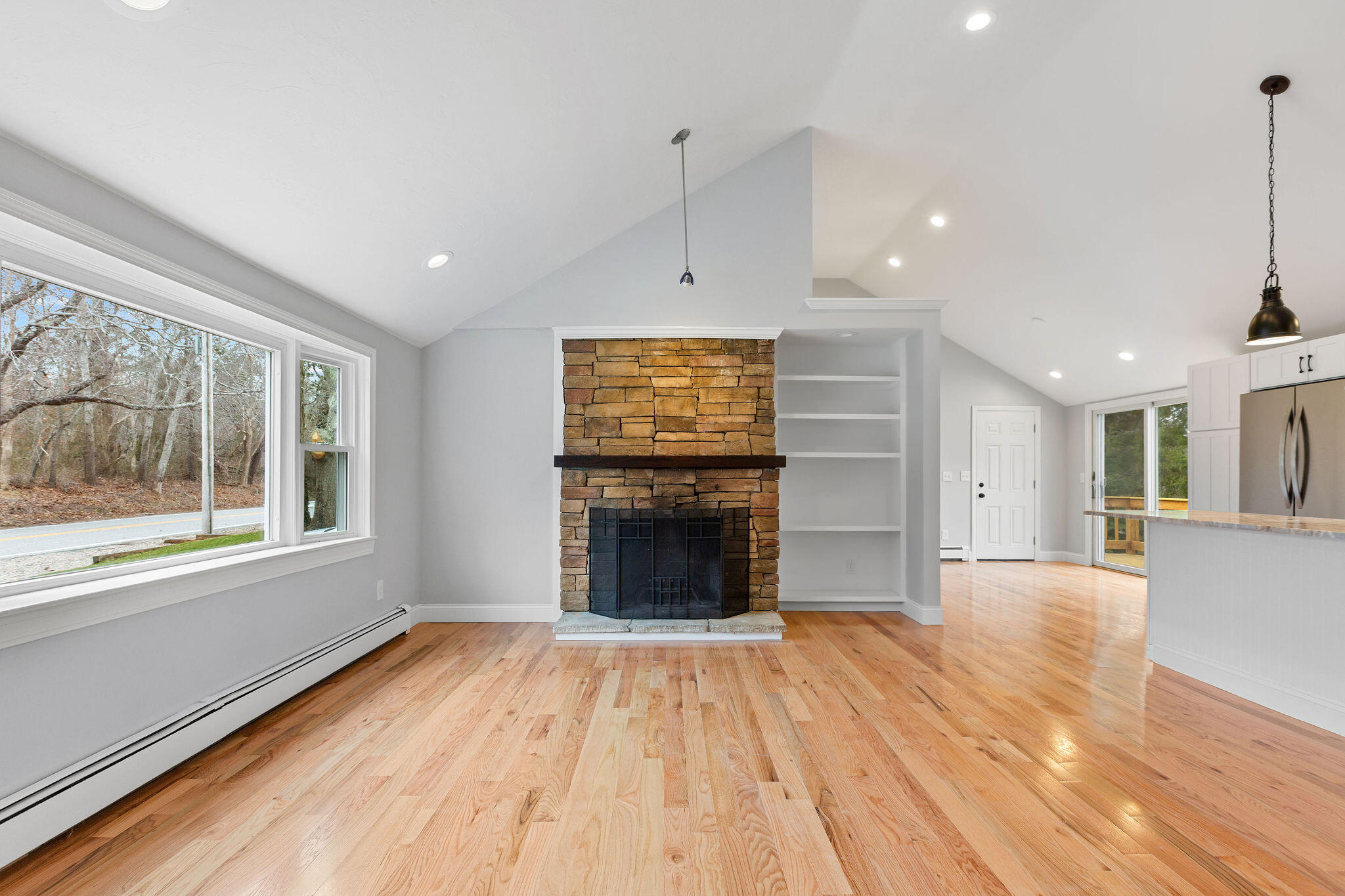 276 Scargo Hill Road South Dennis, MA 02660 - Photo 15 of 53 a view of an empty room with a window and wooden floor