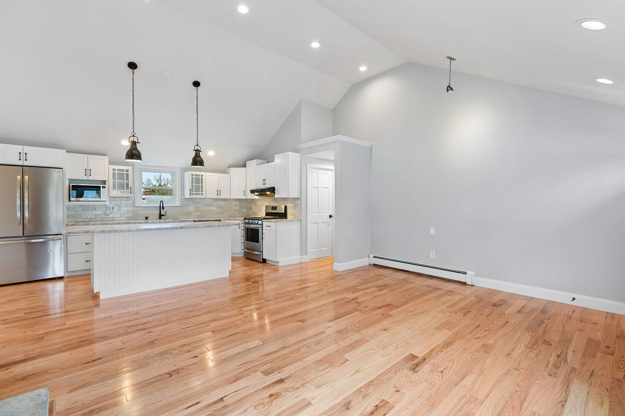 276 Scargo Hill Road South Dennis, MA 02660 - Photo 21 of 53 a large kitchen with kitchen island a stove a sink dishwasher and a refrigerator with wooden floor