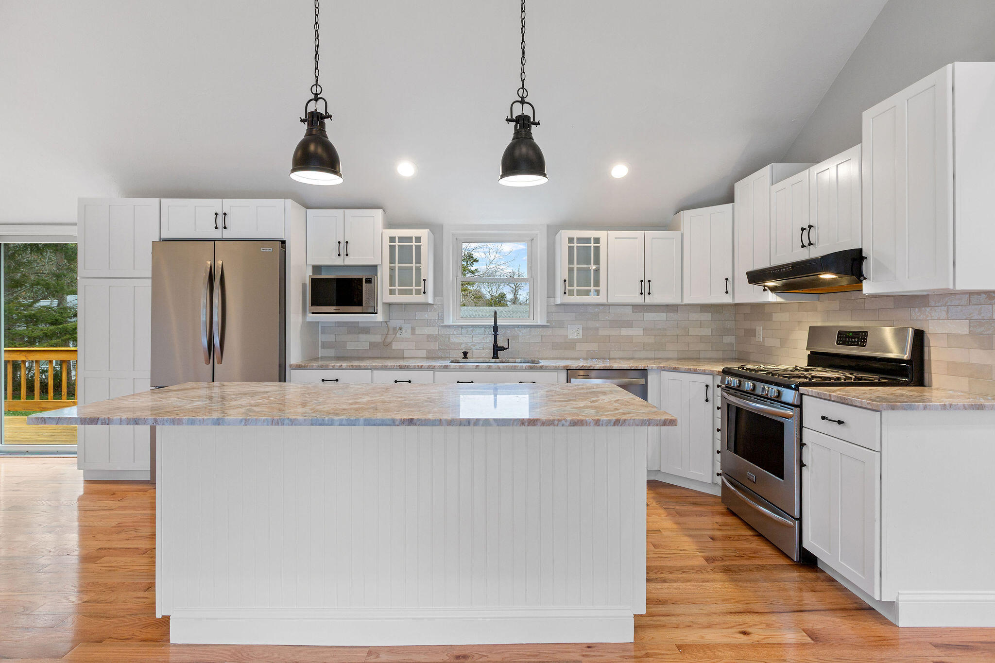 276 Scargo Hill Road South Dennis, MA 02660 - Photo 23 of 53 a kitchen with stainless steel appliances granite countertop a sink a stove a refrigerator cabinets and chairs