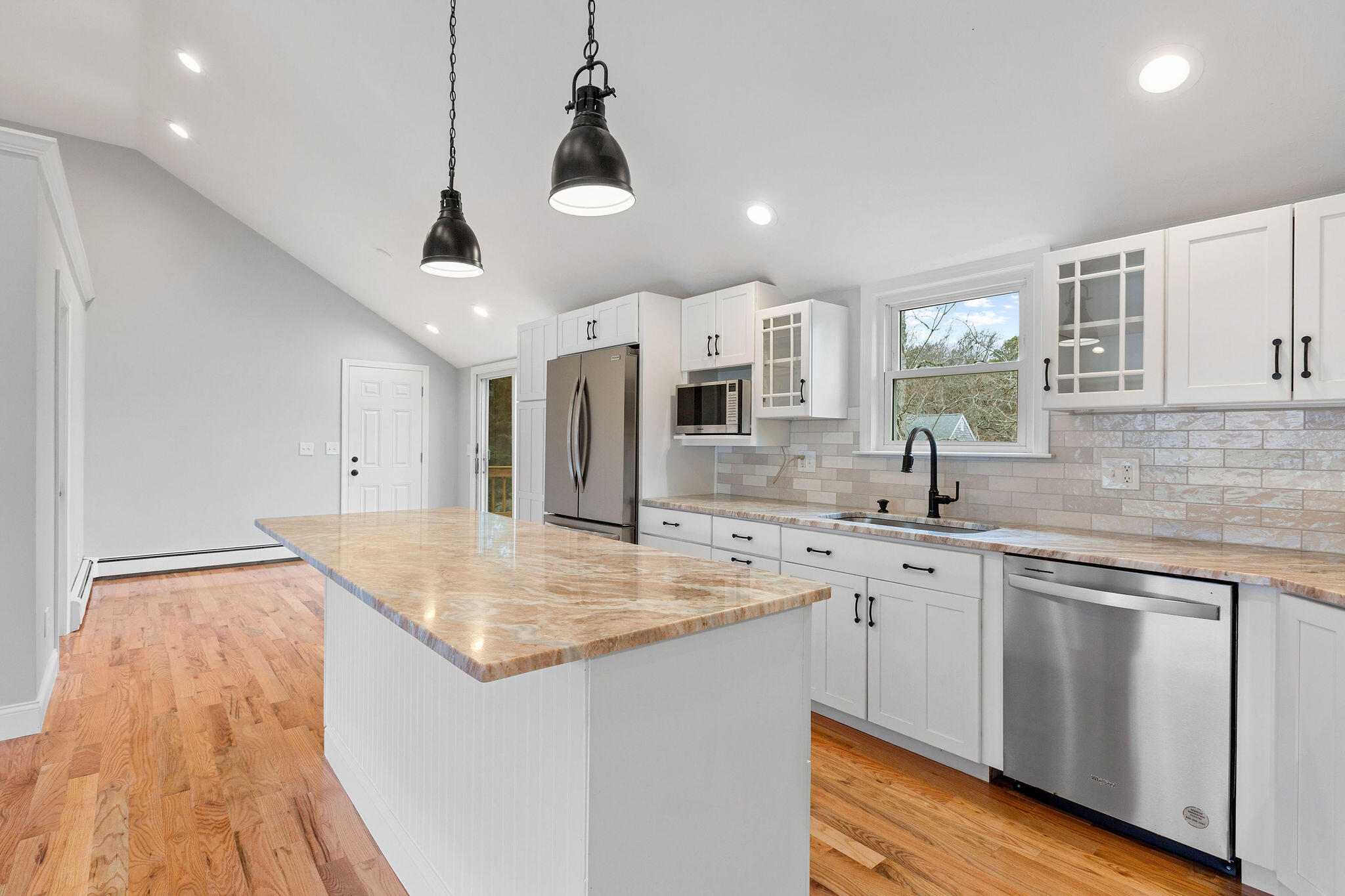 276 Scargo Hill Road South Dennis, MA 02660 - Photo 24 of 53 a kitchen with stainless steel appliances granite countertop a sink and dishwasher with wooden floor